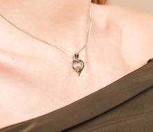 Load image into Gallery viewer, Paw Prints Heart Pendant with Topaz, Sterling Silver & Welsh Gold
