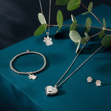 Load image into Gallery viewer, Paw Prints Locket with Topaz, Sterling Silver &amp; Welsh Gold
