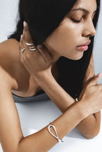 Load image into Gallery viewer, Mercy Twist Bangle Medium, Sterling Silver
